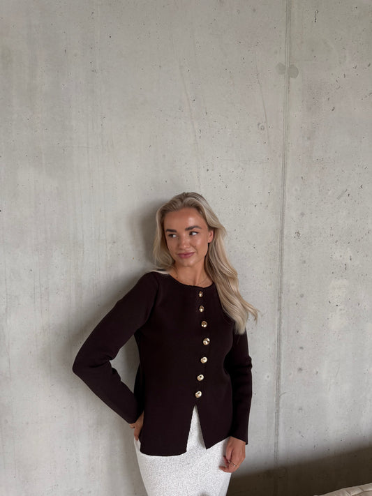 Truitje met gouden knoopje