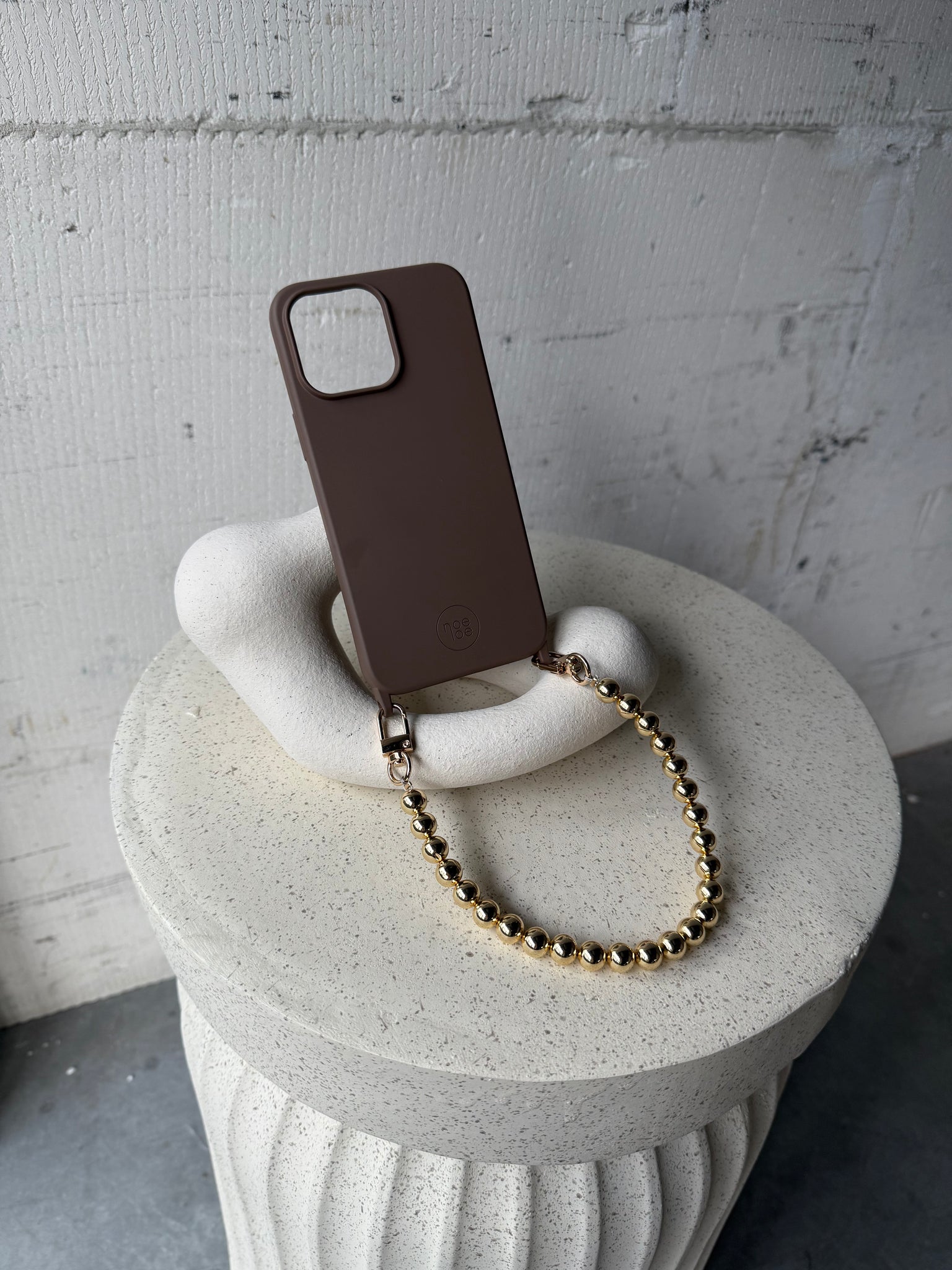 Bruin hoesje + goud koordje
